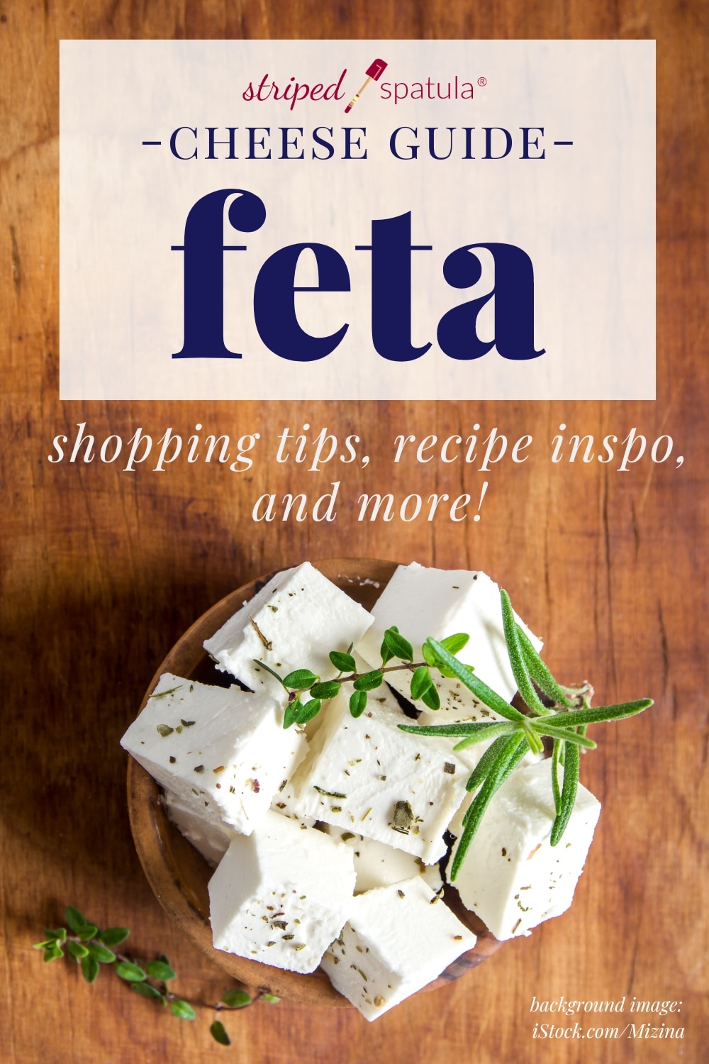 cubed feta in a bowl on a wood surface with text overlay that reads "cheese guide - feta" "shopping tips, recipe inspo, and more!"