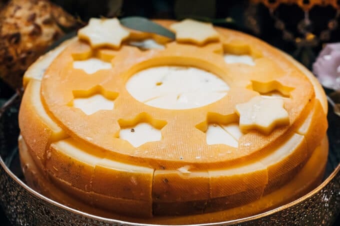 wheel of port salut cheese with star cutouts