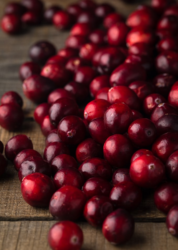 fresh cranberries on a wood board