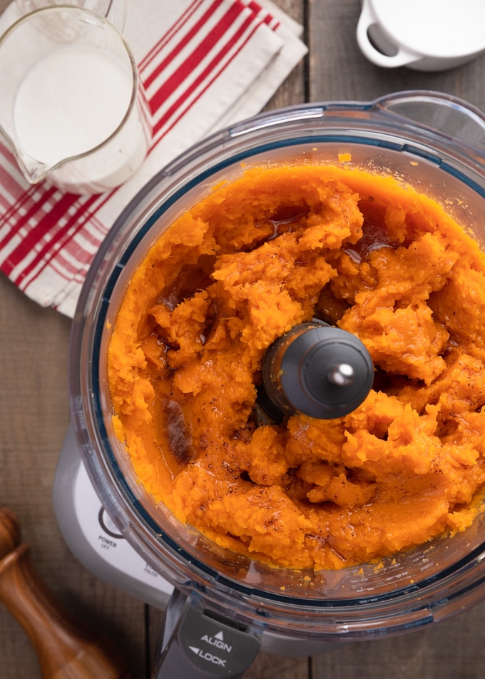 cooked sweet potatoes and brown butter in a food processor