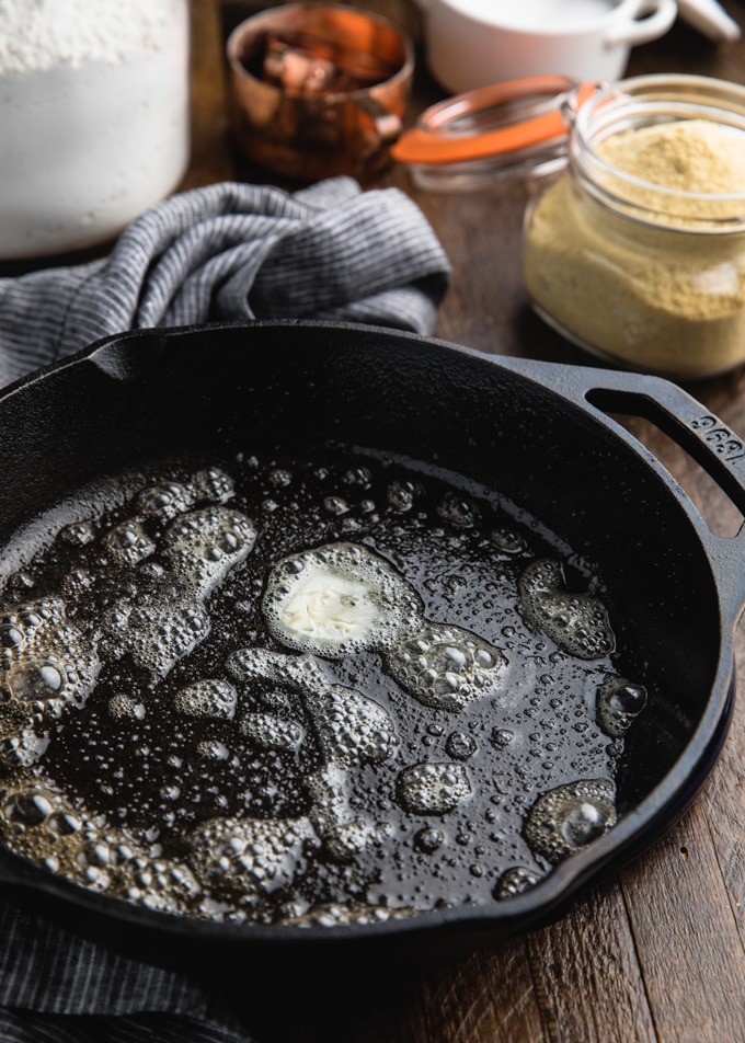 butter melting in a hot cast iron skillet