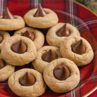 peanut butter blossoms on a red plaid Christmas plate