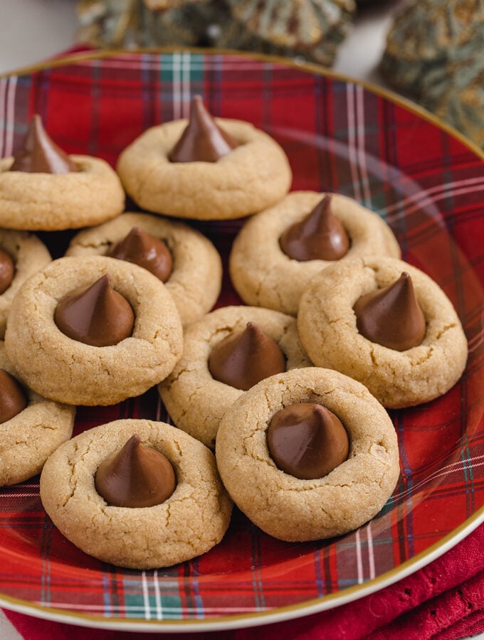 peanut butter blossoms on a red plaid Christmas plate