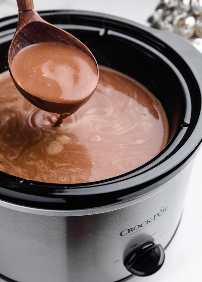 hot chocolate being ladled from a slow cooker