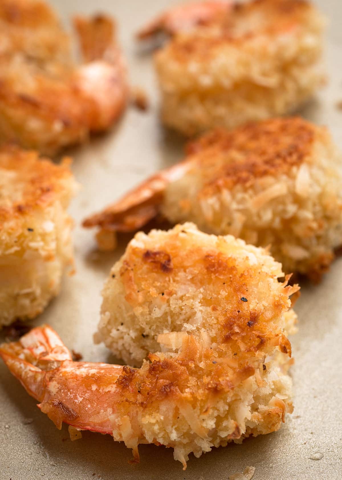 baked coconut shrimp on a baking sheet