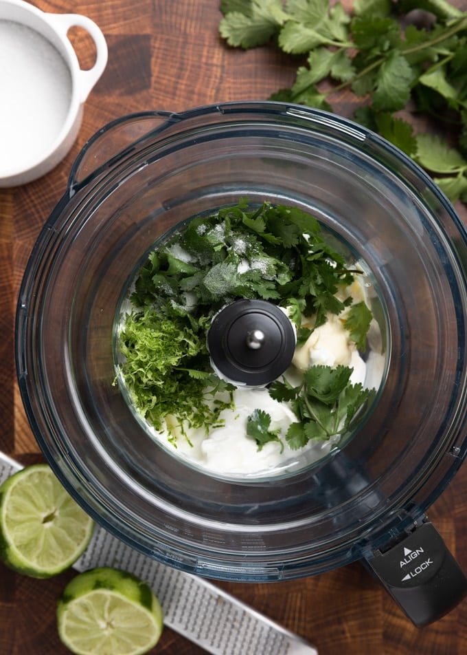 cilantro, lime zest, mayonnaise, and sour cream in the bowl of a food processor