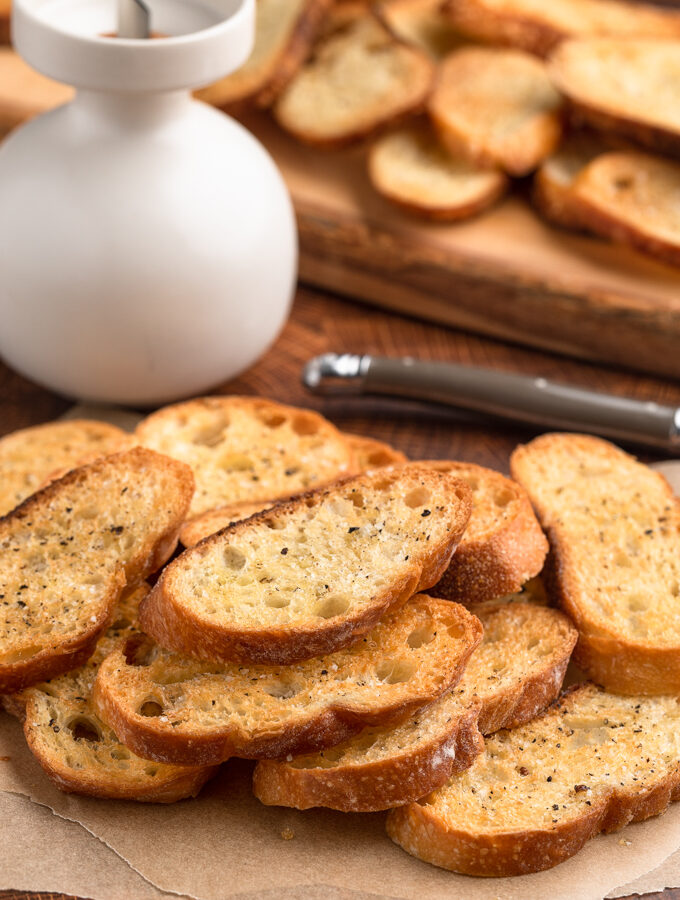 baked crostini toasts on parchment paper