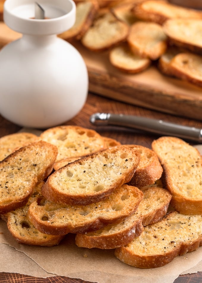 baked crostini toasts on parchment paper