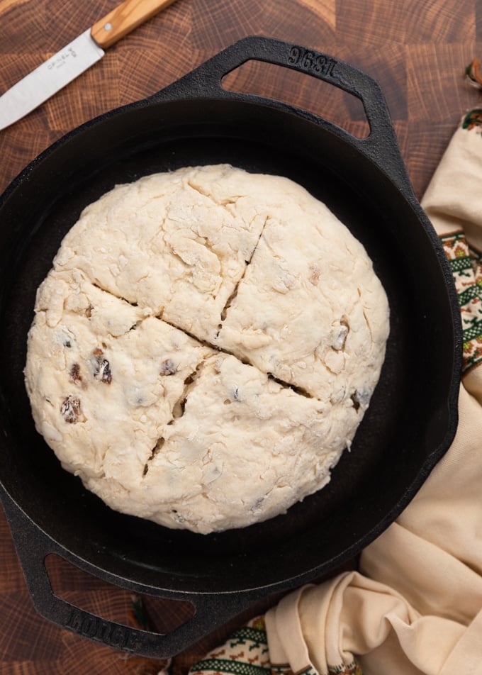 Unbaked Irish-American Soda bread in a cast iron skillet