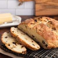 sliced loaf of Irish-American soda bread on a wire baking rack