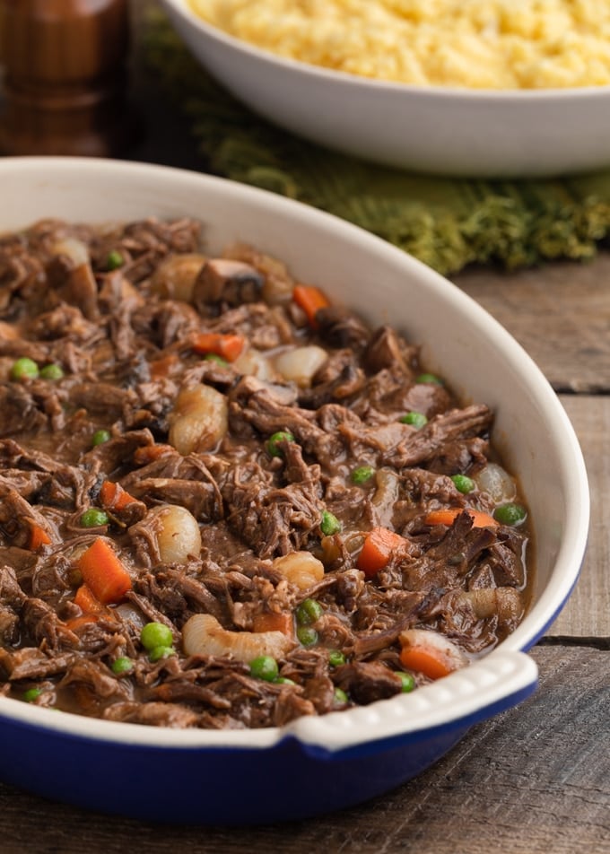 short rib cottage pie filling in an oval cast iron gratin dish