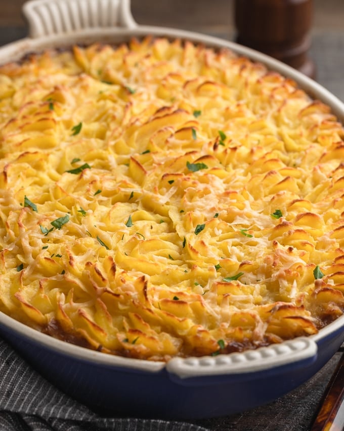 baked short rib cottage pie with Dubliner cheese potato topping in a gratin dish