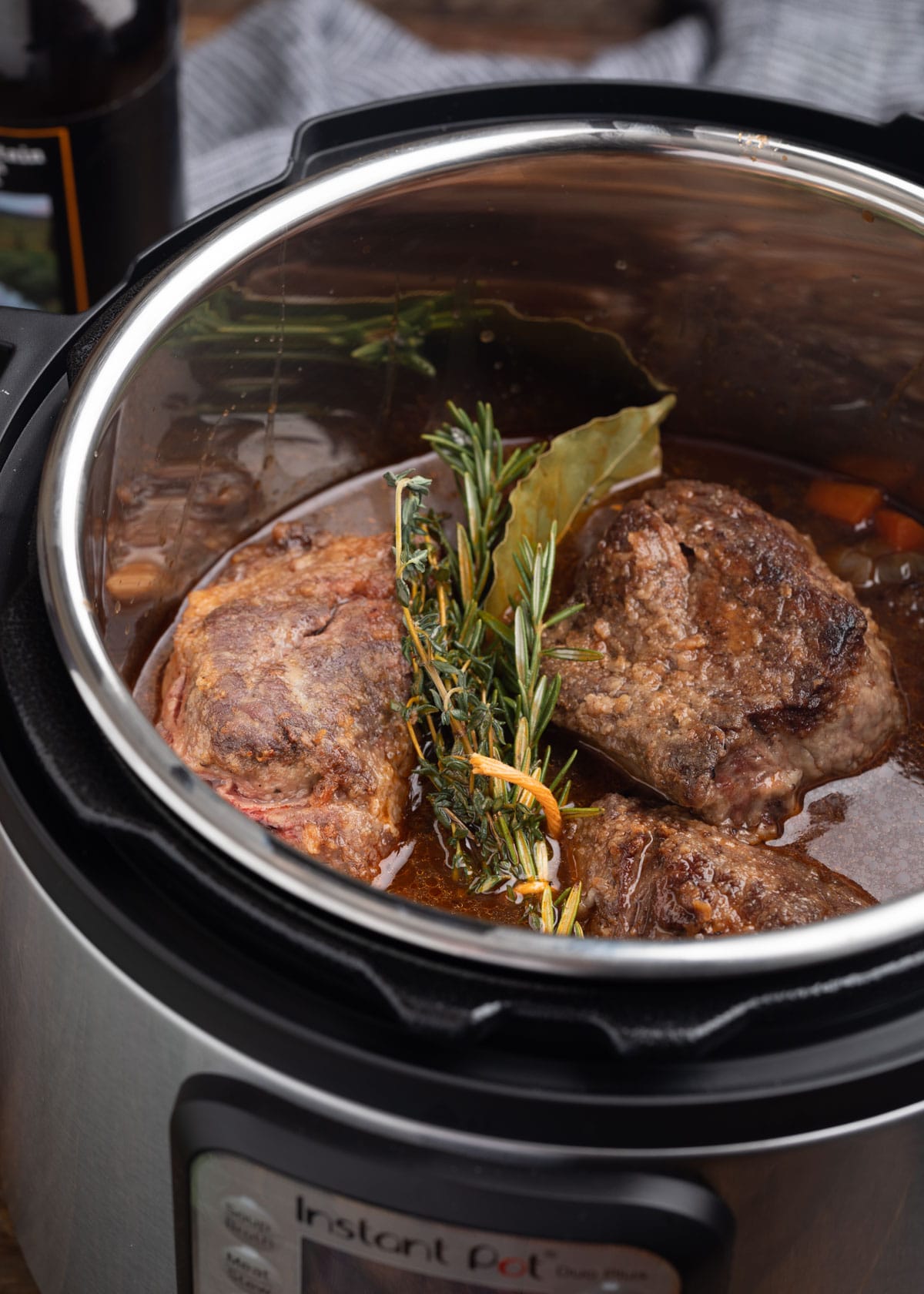 seared short ribs with stout braising liquid in an electric pressure cooker