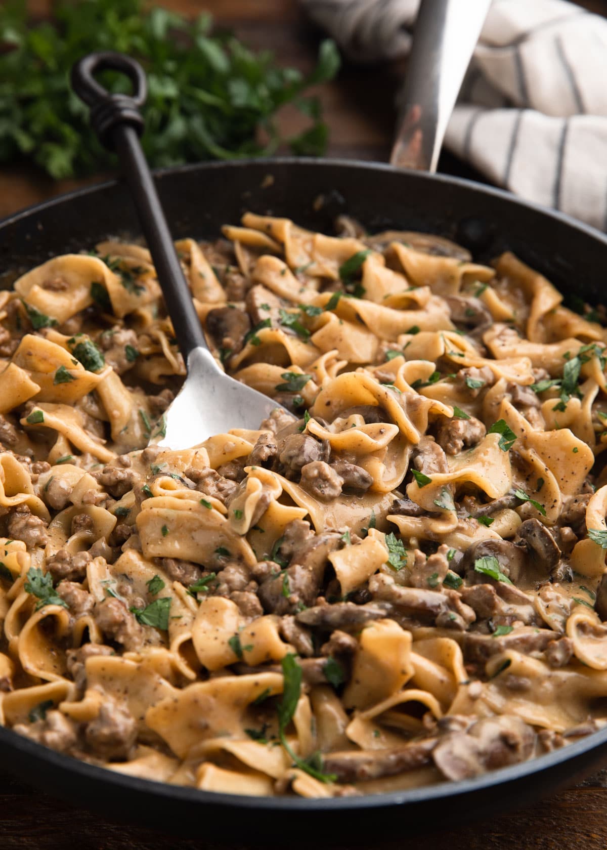 ground beef stroganoff in a large nonstick skillet with a serving spoon