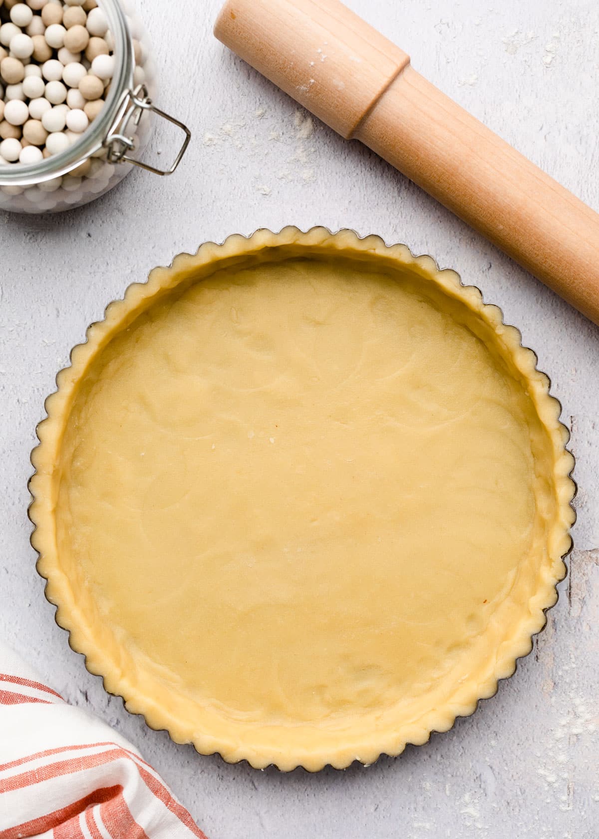 unbaked pate sablee in a tart pan