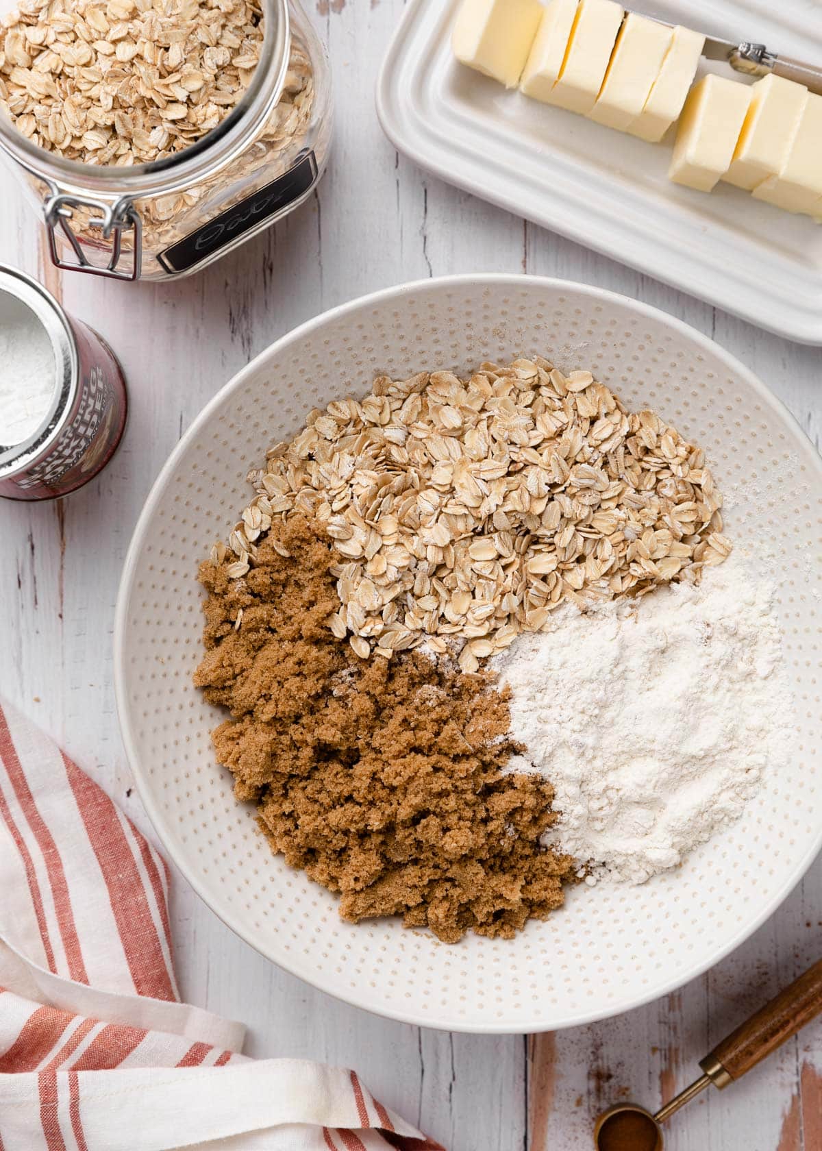 overhead photo of ingredients for apple crisp topping in a large bowl