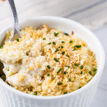 gorgonzola macaroni and cheese in a white ramekin with a spoon