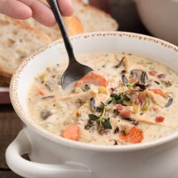 closeup of taking a spoonful of leftover turkey wild rice soup