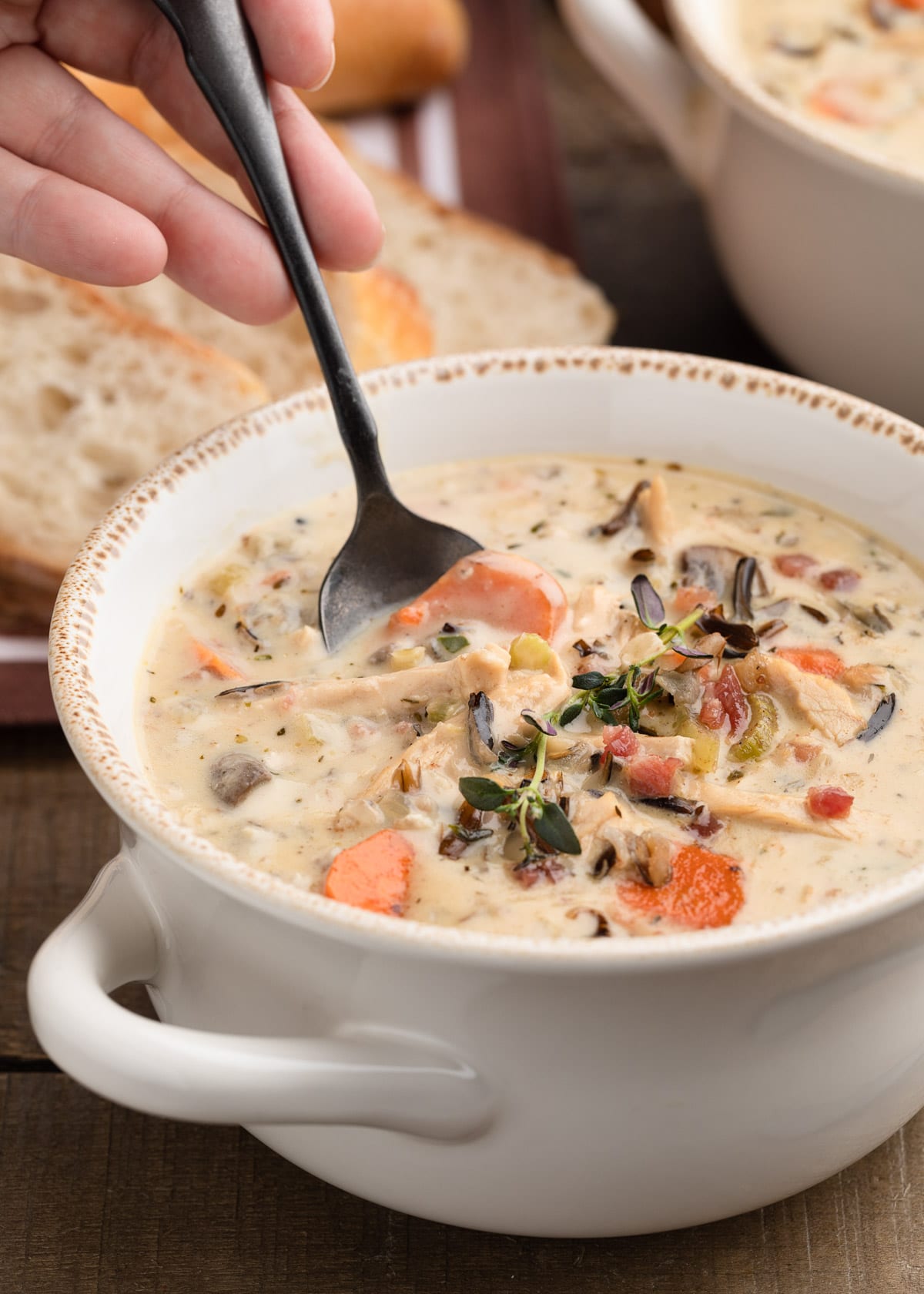 closeup of taking a spoonful of leftover turkey wild rice soup