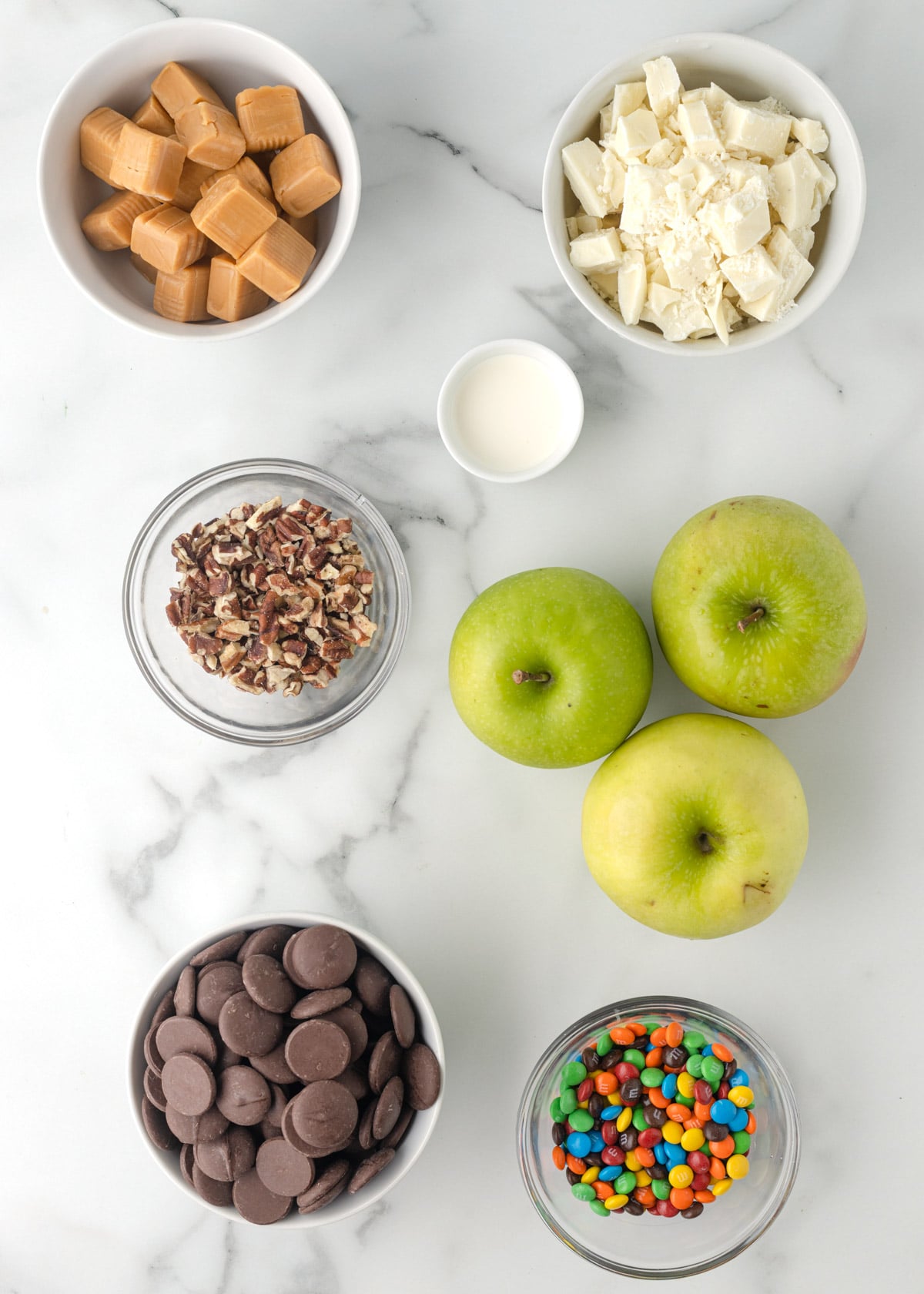 overhead photo showing bowls of ingredients needed to make caramel apple slices