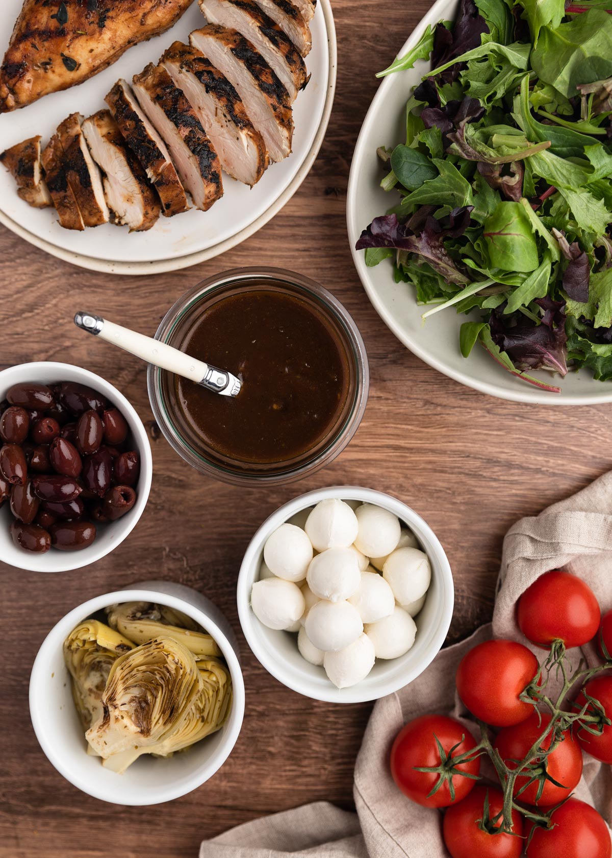 overhead photo of ingredients for balsamic chicken salad in bowls