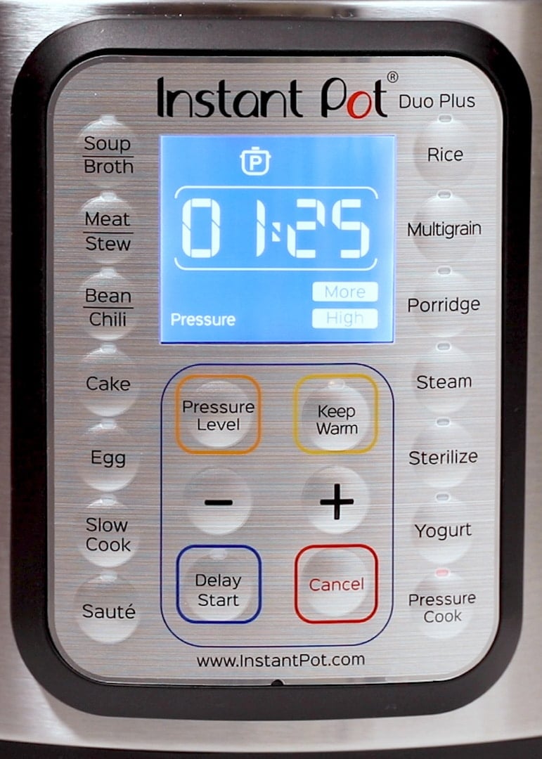 control panel on an Instant Pot showing 1 hour and 25 minutes of cooking time.