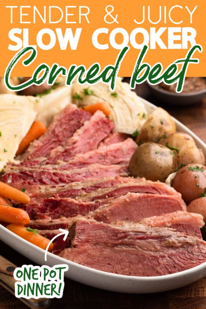 sliced corned beef, cabbage, and potatoes on a platter with text overlays that read "tender & juicy slow cooker corned beef" and "one pot meal!"