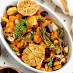 roasted root vegetables in a white casserole dish