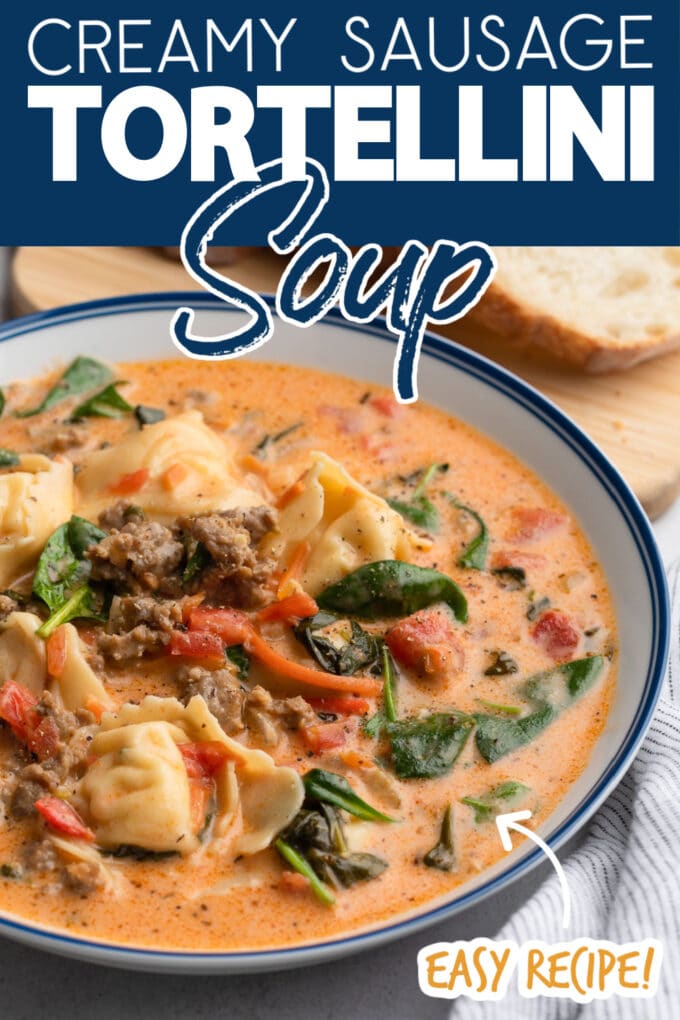 Italian Tortellini Soup in a blue-rimmed white bowl with text overlays that read "Creamy Sausage Tortellini Soup" and "Easy Recipe!"