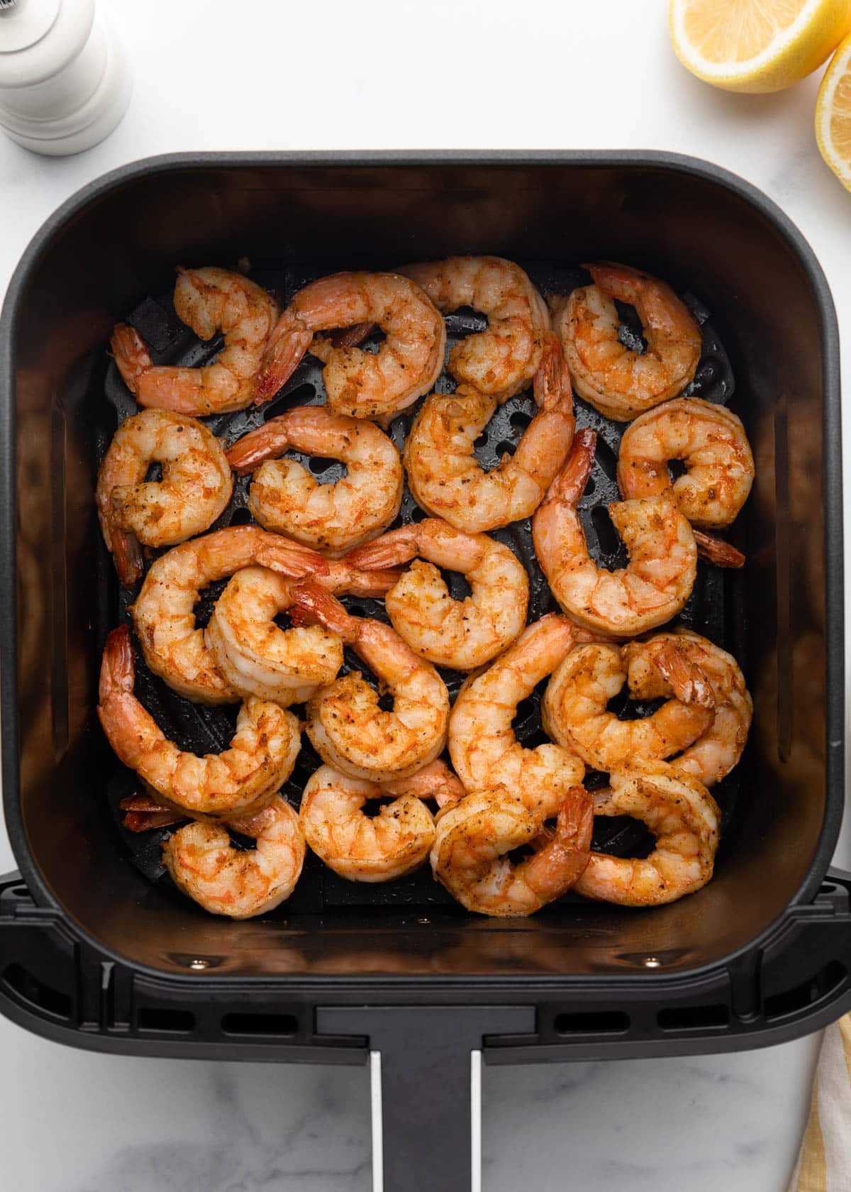 cooked seasoned shrimp in a square XL air fryer basket