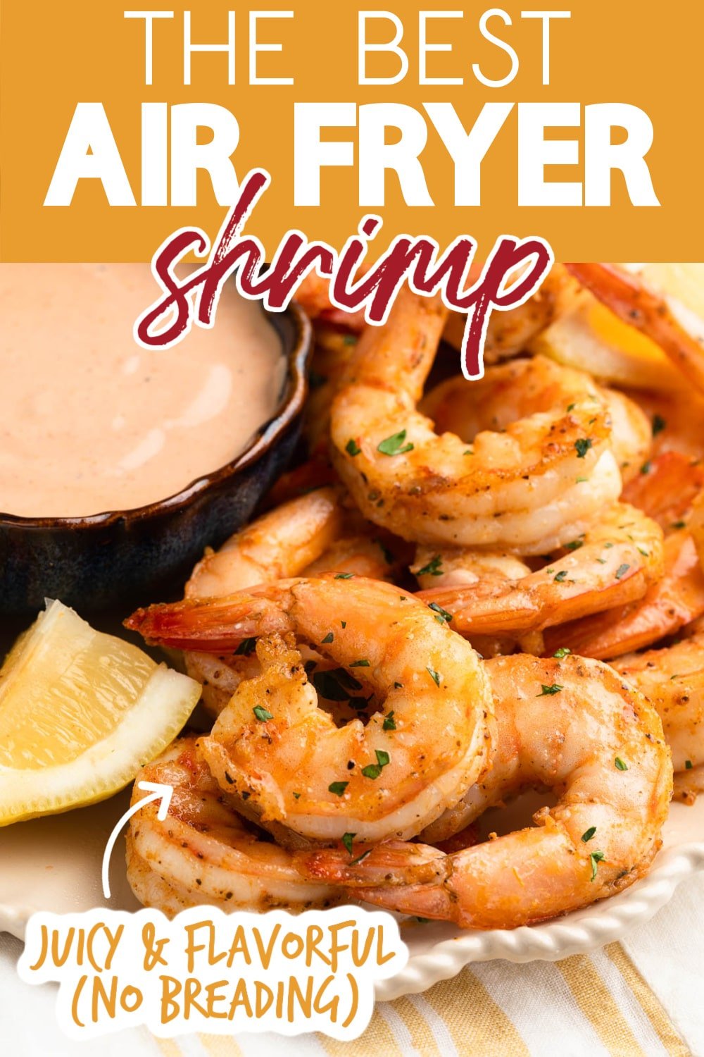 cooked shrimp on an ivory scalloped plate with lemon wedges and a bowl of dipping sauce. Text reads "The Best Air Fryer Shrimp" "Juicy & Flavorful (No Breading)"
