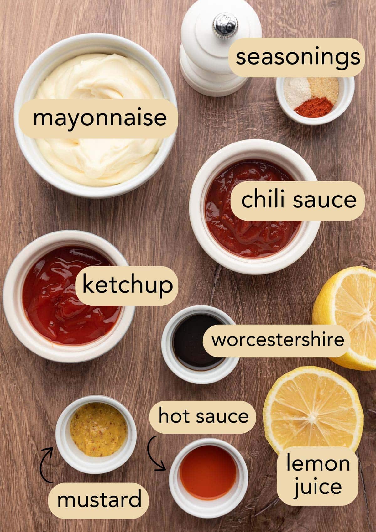 overhead of the ingredients needed to make comeback sauce in bowls on a wood board with text label overlays