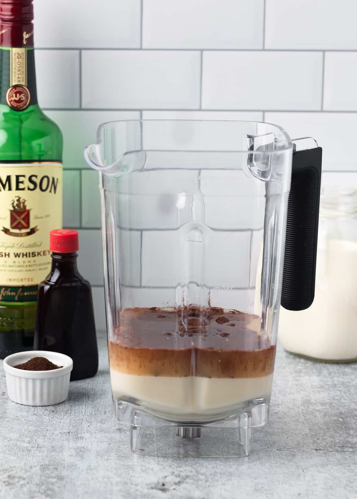 unblended Irish cream ingredients in a blender canister