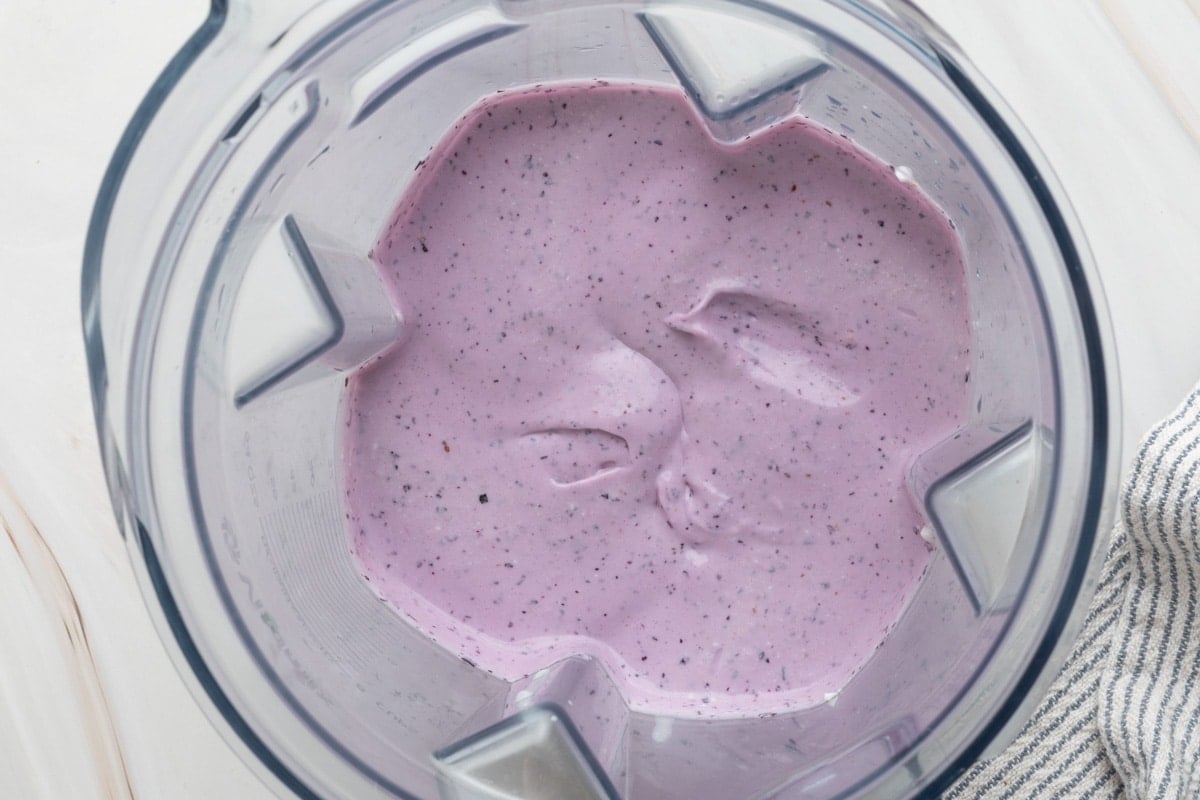 blueberry blended cottage cheese in a blender canister
