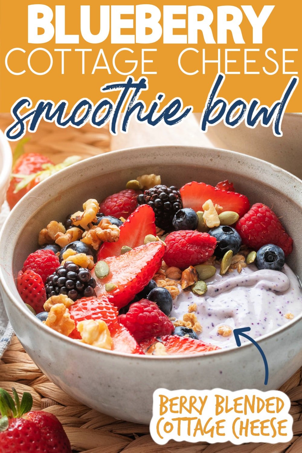 berry blended cottage cheese in a bowl topped with fresh berries, granola, and nuts. Text reads "blueberry cottage cheese smoothie bowl" "berry blended cottage cheese"