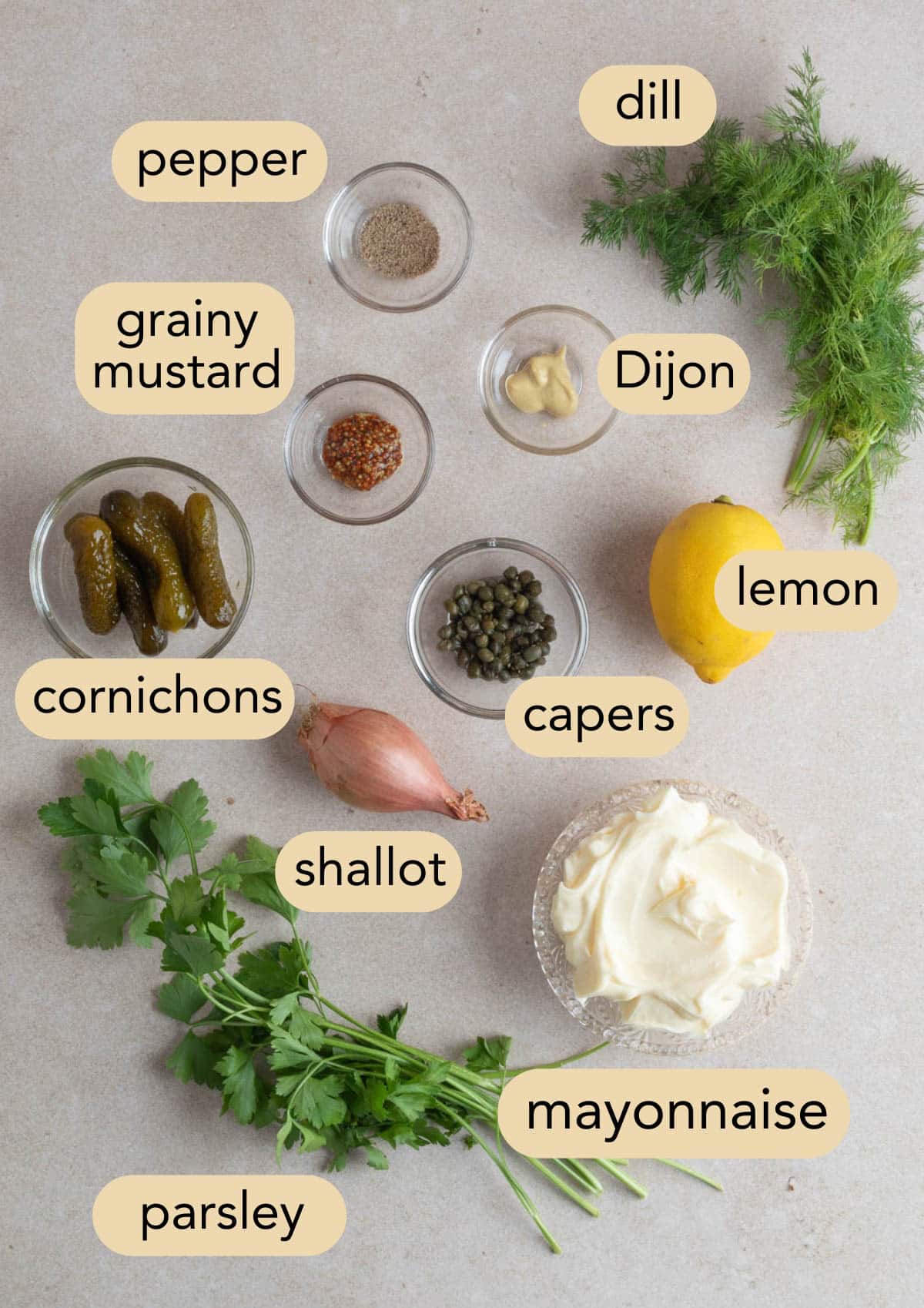 overhead of ingredients needed to make tangy tartar sauce in bowls with text label overlays.