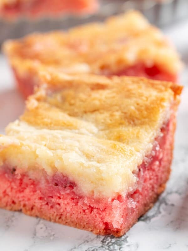 strawberry chess squares on a white marble surface